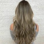 Dark blonde hair with an incredible root shadow. Cynthia kno