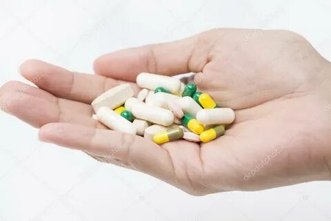 Pills in hand Stock Photo by © Tatomm 53739309
