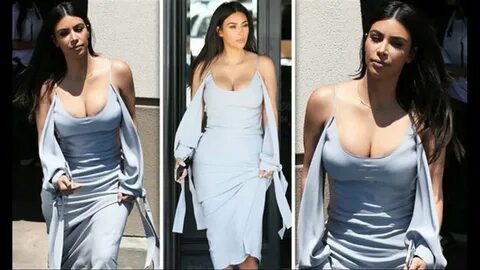 Kim Kardashian puts on VERY busty display as she squeezes as