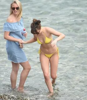 Dakota Johnson in a Yellow Bikini - "Fifty Shades Darker" Se