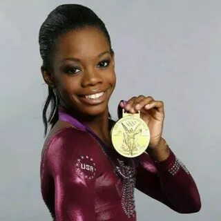 Gabby Douglas proudly shows her Olympic gold medal Gabby dou