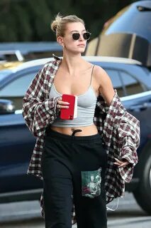 hailey bieber looks trendy in a crop top and sweatpants as s