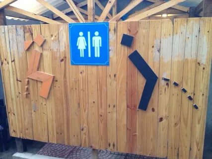 The men’s sign confuses me... is he peeing, or does he have 