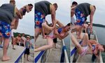Man chucks girls from boat only for her to fall neck-first o
