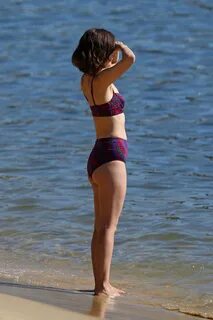 Rose Byrne - In a red and purple patterned two-piece bikini 