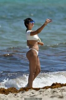 Jackie Cruz cleavage in white bikini on the beach in Miami B