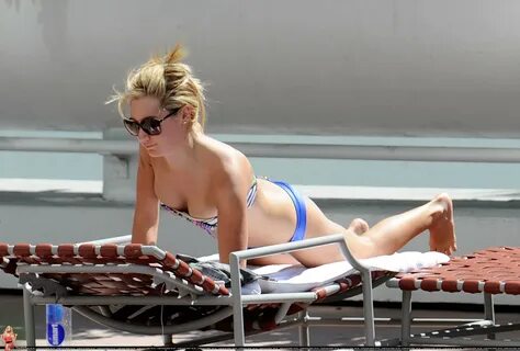 Ashley Tisdale wearing sexy bikini poolside in Miami