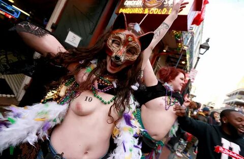 New Orleans Mardi Gras festival sees women flash their boobs