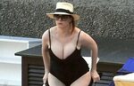 christina-hendricks-in-black-one-piece-swimsuit-italy-may-20