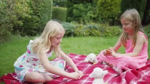 Video Stok 4k 2 little girls having tea (100% Tanpa Royalti)