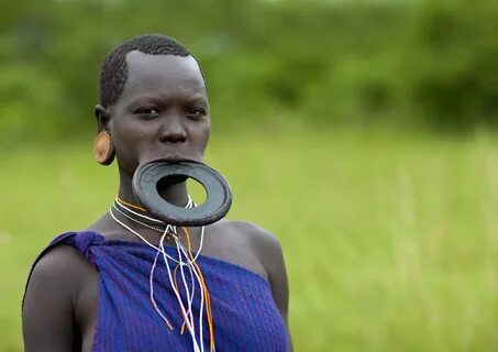 Surma woman with big lip plate - Omo Ethiopia For the Dong. 