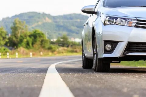 New Silver Car Parking On The Asphalt Road - United Auto Ren