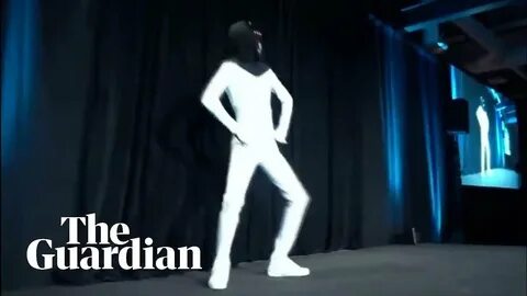 Elon Musk unveils plan for 'Tesla Bot' with man dancing in a