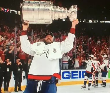 Female Capitals Fan Flashes Alexander Ovechkin Through the Glass As He Hois...