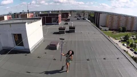 Drone discovers a woman doing topless on a roof - YouTube