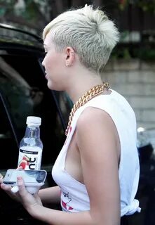 Miley Cyrus braless showing side boob outside the 'Whole Foo