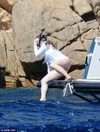 Chelsea Clinton snorkels with husband Mark in Sardinia, Ital