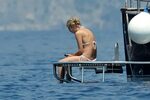 Sharon Stone tanning topless & showing ass crack on a yacht 