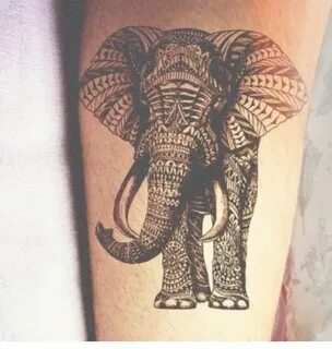 Elephant tattoo for inner bicep trunk up symbolizes good luc