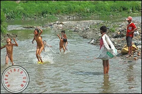 Two side of children life A group of children were enjoyin. 