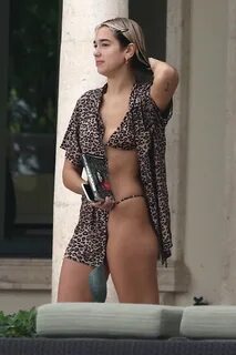 dua lipa wears a leopard print bikini while enjoying some do