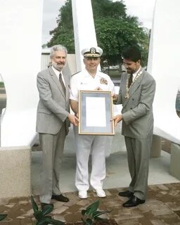 VADM Stanley R. Arthur, commander, Seventh Fleet, presents a