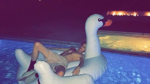 Jace Norman Is Floating On a Inflatable Swan Pool Float. Nor