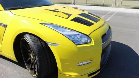 Viewing the yellow wrap on a Nissan GT-R r35 track edition. 