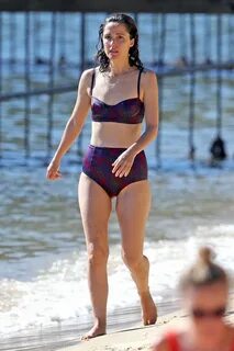 Rose Byrne - In a red and purple patterned two-piece bikini 