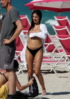 Giulia De Lellis in bikini and topless during photoshoot in Miami.