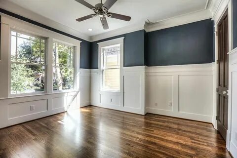 Master Bedroom with wainscoting, wood floors & wallpaper. Wh