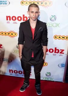 Newly shaven-headed Moises Arias at the premiere of his film
