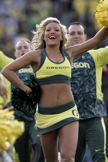 The Oregon cheerleaders run out on the field before Oregon's