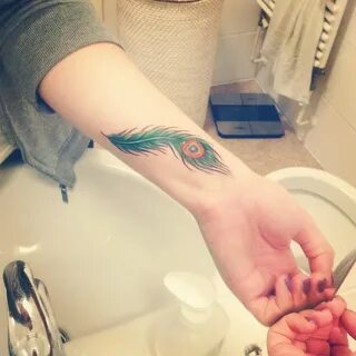 Pin by Luca Molari on Tattoos Feather tattoo wrist, Peacock 