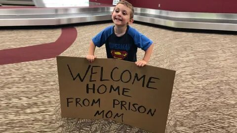Son tricks mom with 'Welcome home from prison' sign at airpo