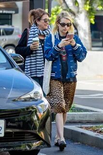 Emma Roberts wore a leopard print skirt and blue jacket whil