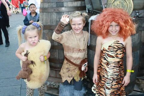 Sandy, guy and Eep from the Croods in Disneyland Dress up co