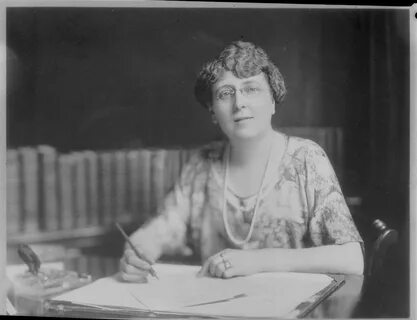 File:Portrait of Lucy Maud Montgomery at her desk, holding a