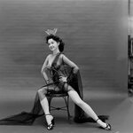 Showgirl and burlesque dancer sitting on a chair, Las Vegas,