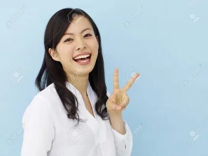 Why do japanese girls make peace signs in photos