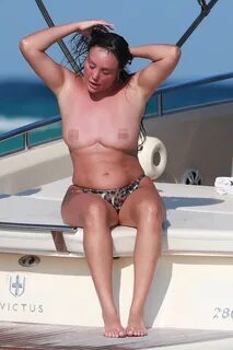 Charlotte Crosby strips topless on yacht trip with boyfriend