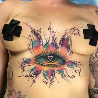 Wings tattoo between boobs