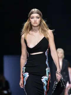 Gigi Hadid showing her bare boob on a runway at the Versace 