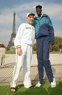 Chris Mullins and Manute Bol in front of the Eifel Tower. Ch