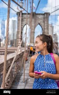 Woman texting walking hi-res stock photography and images - Alamy