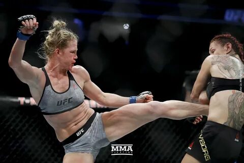 Holly Holm lands a body kick at UFC 219. 
