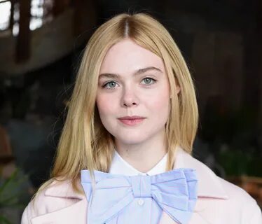 Elle Fanning looks hella angelic in this drapey white number