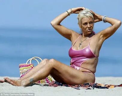 Tanning Mom Patricia Krentcil hits beach in cut-out swimsuit