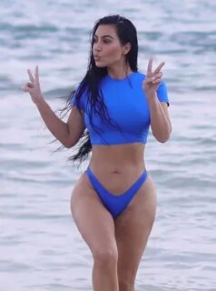 Kim Kardashian shows off killer curves in blue bikini on the