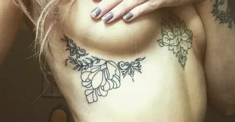 Floral/Ornamental style under breast tattoo on Olivia.